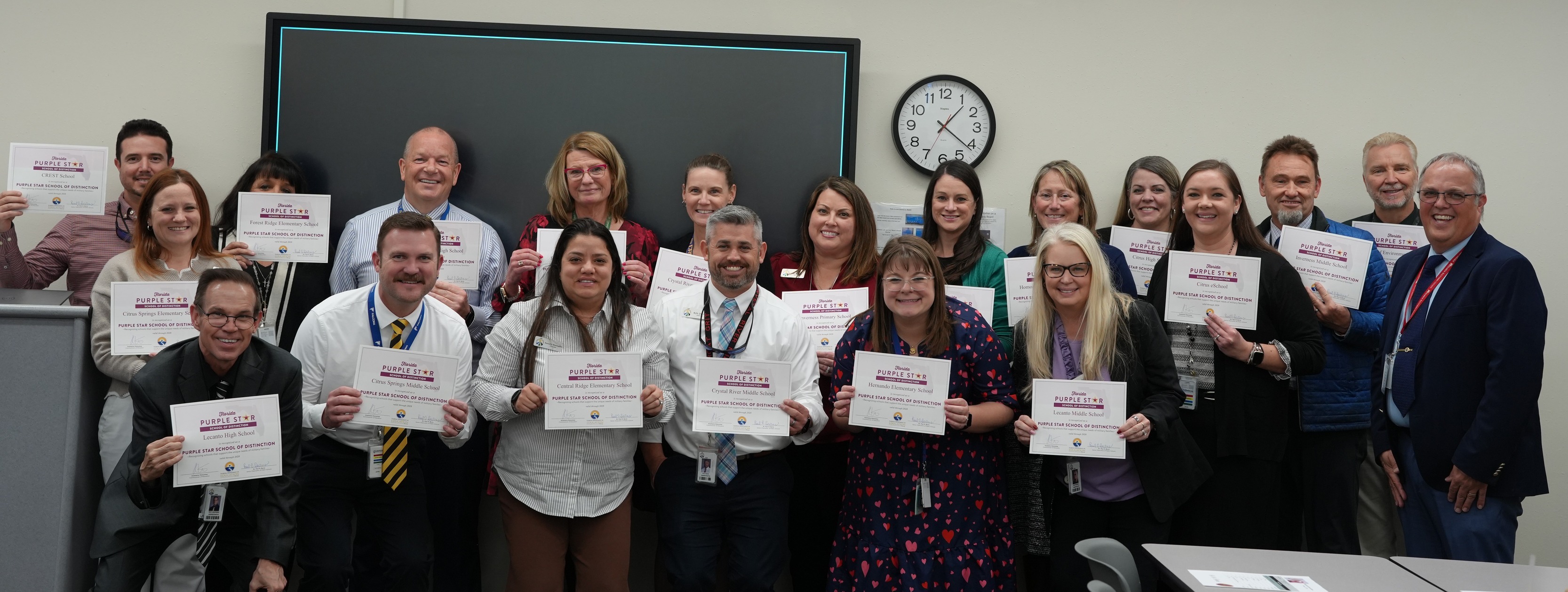 Citrus County School District Administrative Staff holding Purple Star designation certificates.